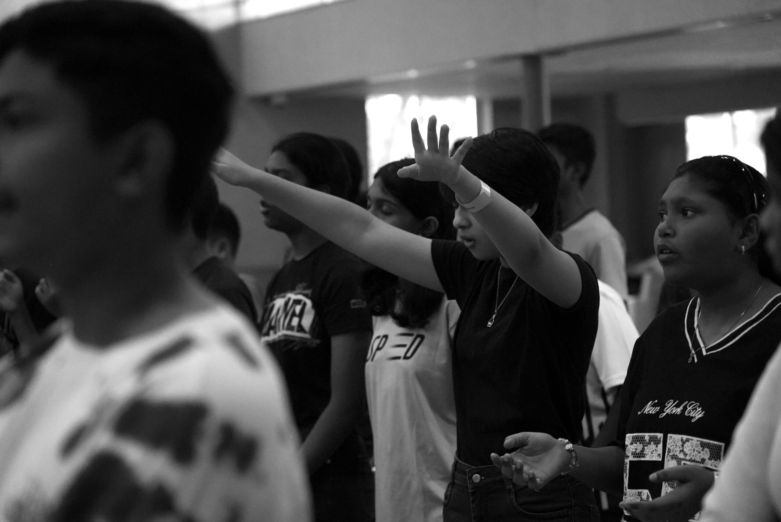 A young girl worshipping God at Deep Dive program by City Harvest AG Church