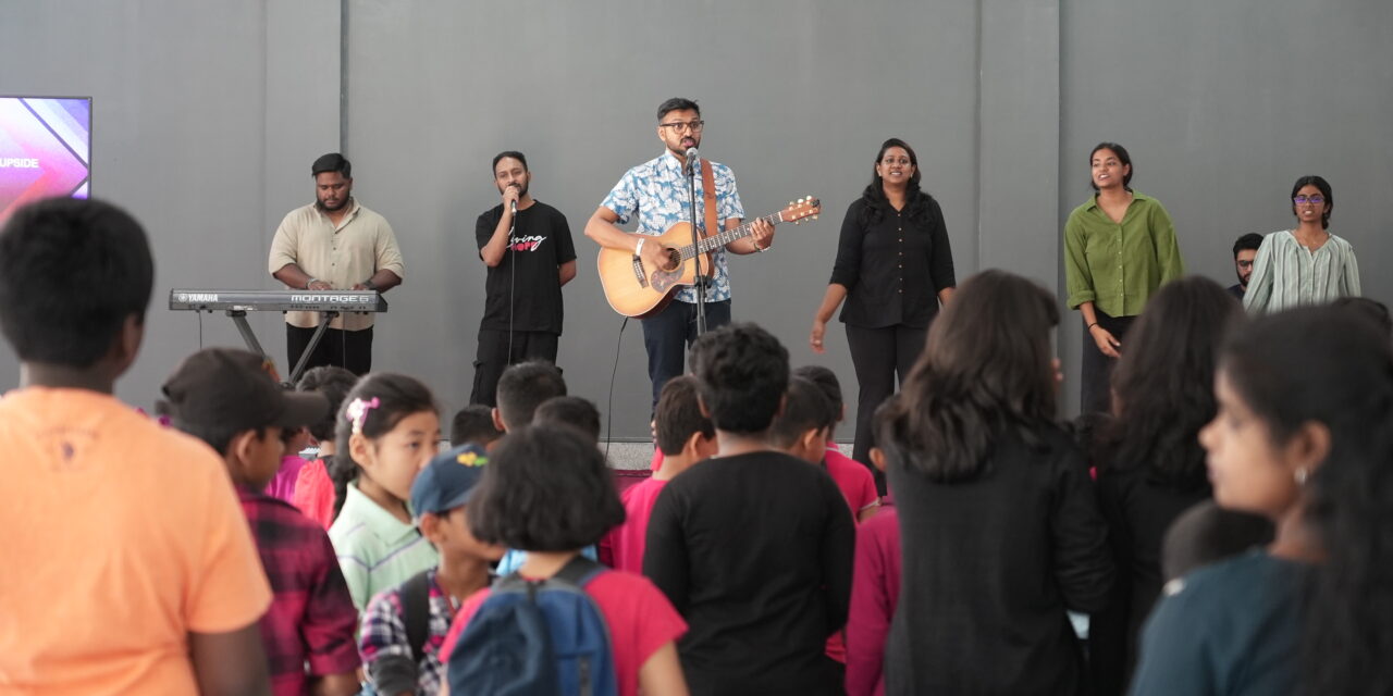 Children participating in a fun and joyful worship session.